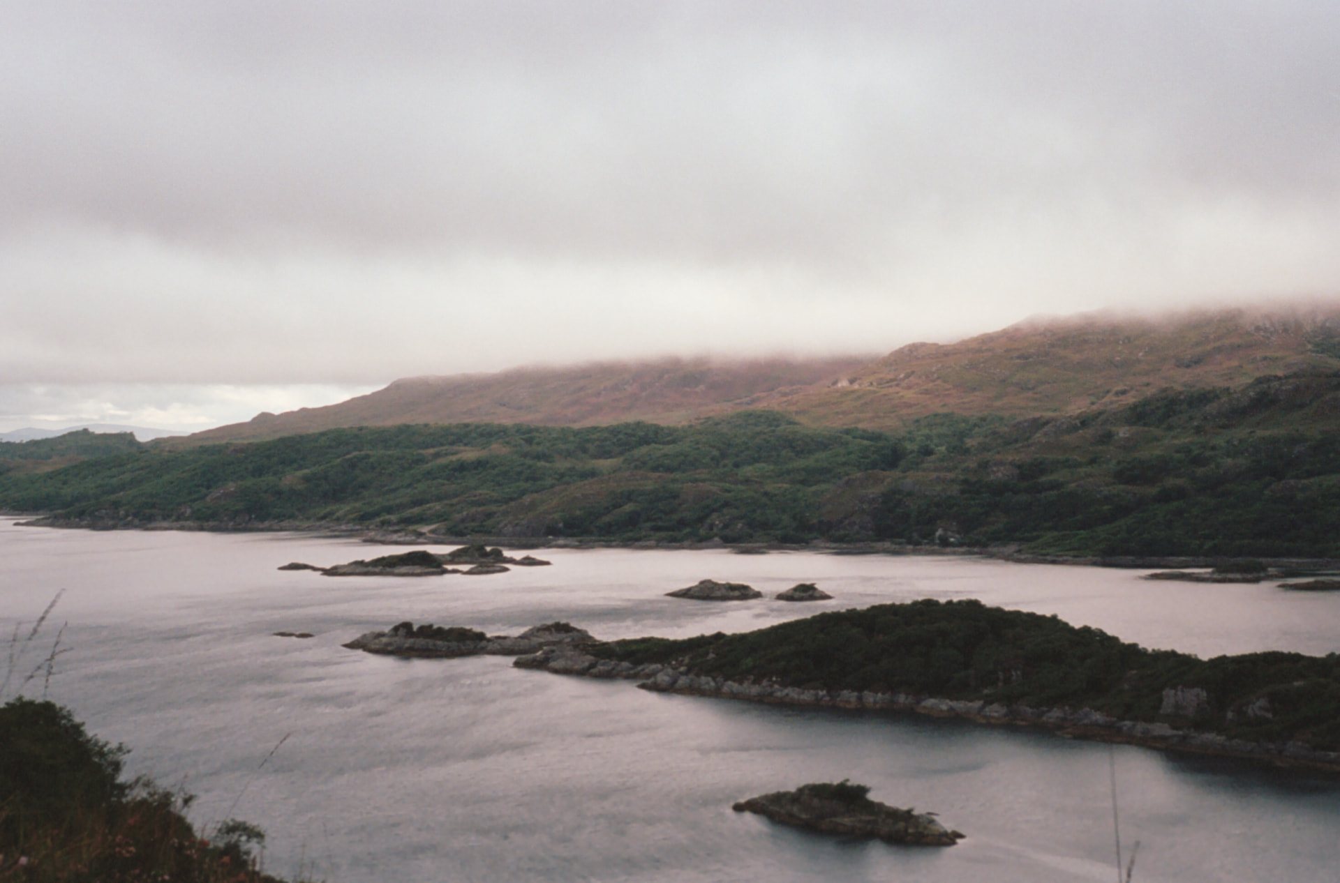 A quiet Highland coast beneath low mist